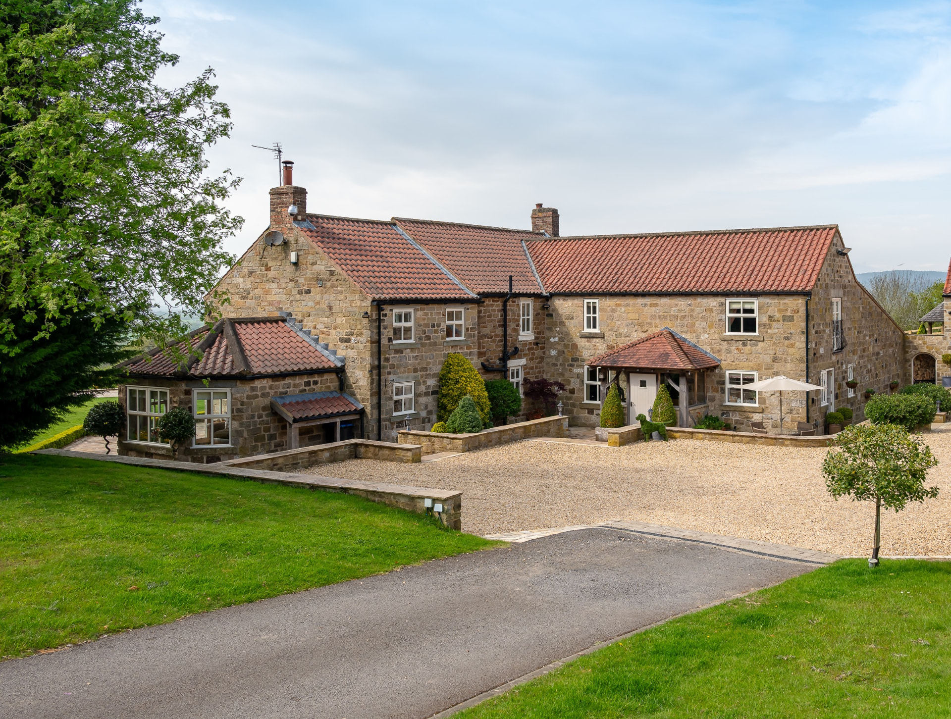 Osgoodby Cottage stone house and courtyard in the North Yorkshire countryside